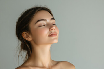 A close up of a girl's face with her eyes closed