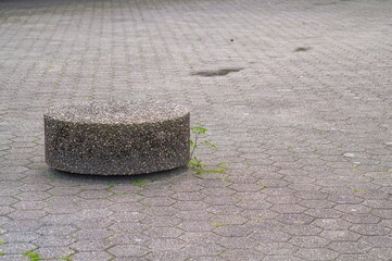 Exposed aggregate concrete bollards on a paved forecourt © Ulrich