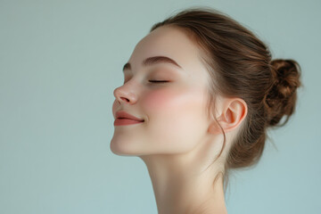 Fototapeta premium A close up of a girl's face with her eyes closed