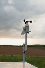 Cup anemometer rotates when the sky is overcast. Wind mast for measuring wind speed, pyranometers...