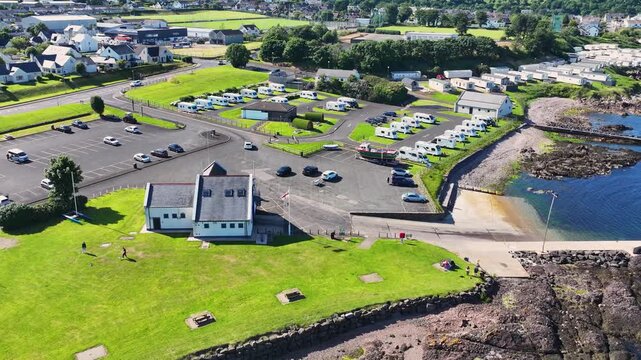 Aerial View of RNLI Lifeboat station Red Bay Cushendall on the Irish Sea Co Antrim Northern Ireland on a sunny day with a blue sky 27-07-24