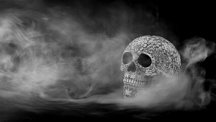 decorative skull with smoke on a black background