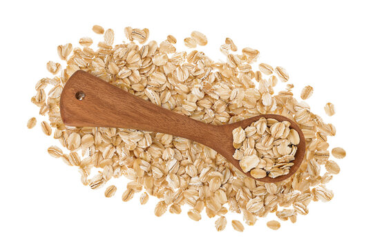 Oat flakes in wooden spoon isolated on white background with full depth of field. Top view. Flat lay
