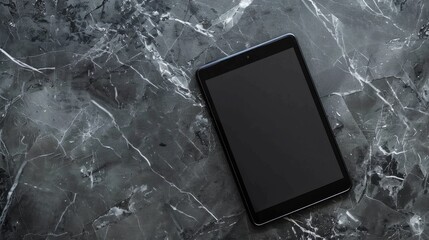 Tablet with isolated screen on gray marble surface