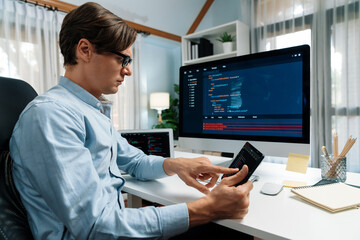 Fototapeta premium IT developer selecting by point on coding online software development information on tablet comparing with pc and laptop screen with new code program on update version overall system. Pecuniary.