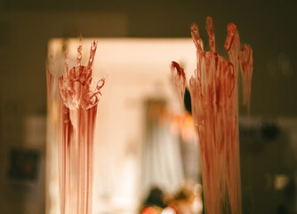 Portrait of bloody traces of hands.