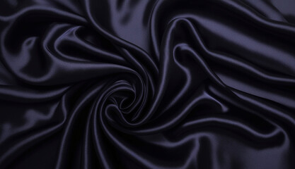 Fototapeta premium Swirled Black Satin Fabric with Smooth Texture and Elegant Folds