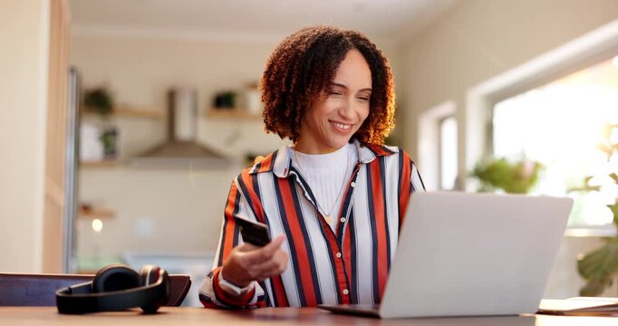 Happy woman, laptop and online shopping with credit card for payment, transaction or banking on table at home. Young female person or shopper with smile, computer or debit for fintech or ecommerce