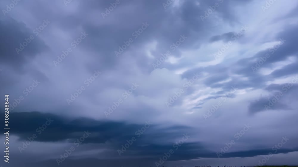 Poster as the cold front approaches thick layers of gray clouds stack up creating an otherworldly and foreb