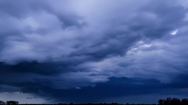 A deafening crack of thunder echoes through the sky as the rolling storm clouds collide in a clash of dark and light.