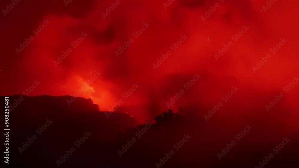 Poster as the fire rages on the smoke transforms into a deep red haze making it difficult to see through.