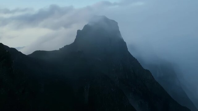 A dramatic view of the mist shrouded peak giving an air of mystery and intrigue.