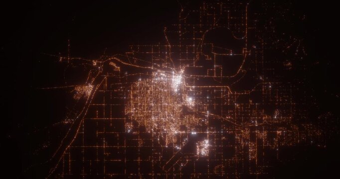 Yuma (Arizona, USA) aerial view at night. Top view on modern city with street lights. Camera is flying above the city, moving backward