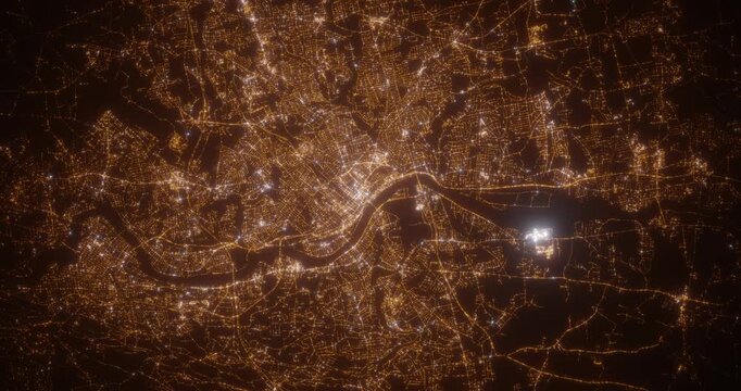 Springfield (Massachusetts, USA) aerial view at night. Top view on modern city with street lights. Camera is zooming out, rotating counterclockwise. Vertical video. The north is on the left side