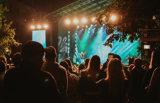 concert with a crowd of people who came to watch the event in the evening in Estonia
