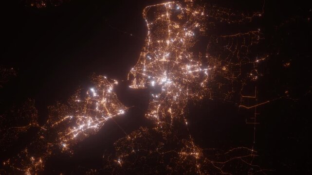 Norfolk (Virginia, USA) aerial view at night. Top view on modern city with street lights. Camera is zooming out, rotating clockwise. Vertical video. The north is on the left side