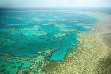 Aerial view of the Great Barrier Reef, the world's largest coral reef system located in the Coral Sea, off the coast of Queensland, Australia