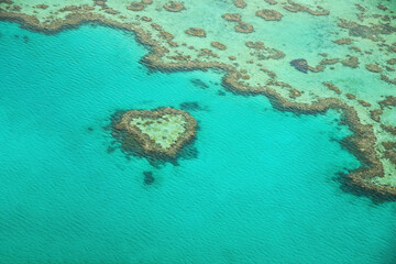 Aerial view of the Heart Reef, a coral reef in the shape of a heart in the Great Barrier Reef, the world's largest coral reef system located in the Coral Sea, off the coast of Queensland, Australia
