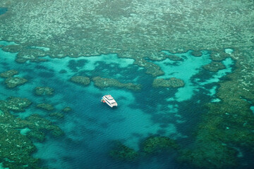 Aerial view of a catamaran in Bait Reef in the Great Barrier Reef, the world's largest coral reef...