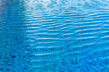 Swimming Pool Surface With Light Reflection and Water Ripple Patterns