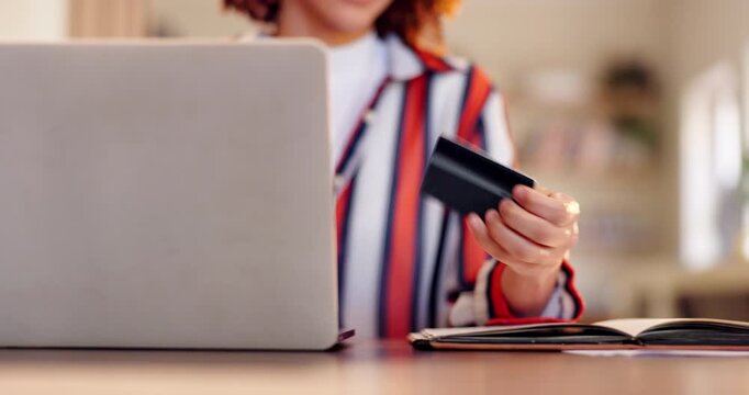 Woman, hands and laptop with credit card for online payment, shopping or banking on table at home. Closeup of female person or shopper with computer or debit for transaction, fintech or ecommerce
