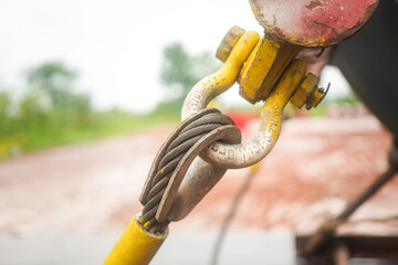Large size of steel wire rope sling, shackle and master-link hook, its using for lifting heavy object. Industrial equipment, close-up and selective focus.
