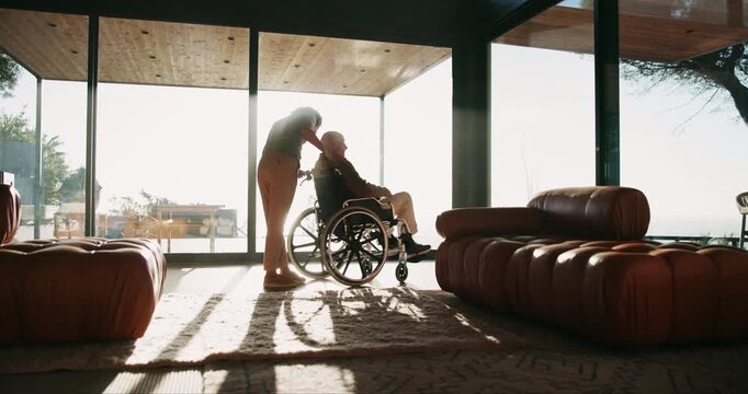 Caregiver, support and senior man with wheelchair for rehabilitation, help and afternoon sun by window. Retirement home, woman and person with disability for mobility assistance, recovery and service