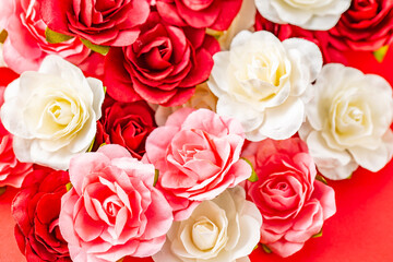 Pink, red and white artificial roses.
Image of rose flowers.