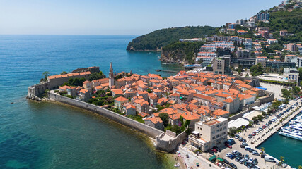 Aerial view of the Old Town of Budva, built on a peninsula along the coast of the Adriatic Sea in Montenegro - Walled coastal city built by the Venetian Republic