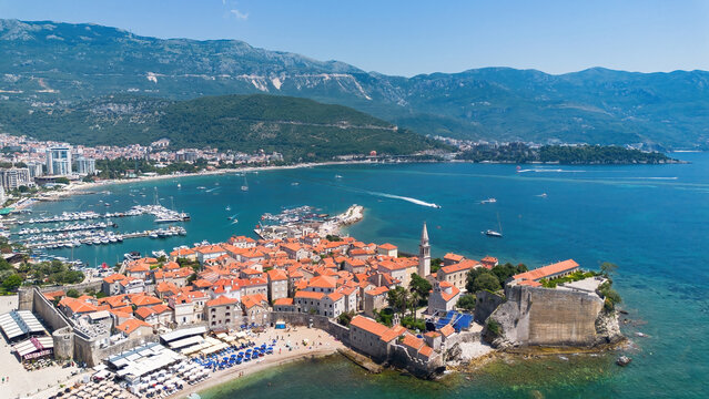 Aerial view of the Old Town of Budva, built on a peninsula along the coast of the Adriatic Sea in Montenegro - Walled coastal city built by the Venetian Republic