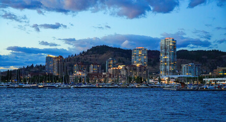 Panoramic view of Kelowna's waterfront at twilight - The third largest city in British Columbia,...