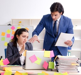Two colleagues employees working in the office