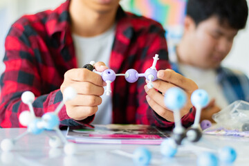 Students are studying simulate shape of covalent molecules by connecting molecular function shapes...