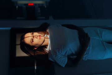 Female Patient Being Ready for Head Radiology Scan. Woman being medically checked after head trauma injury 
