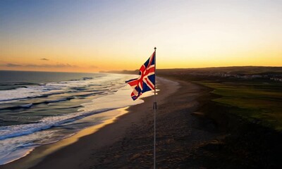 Union Jack Flag on a Sandy Beach - Powered by Adobe
