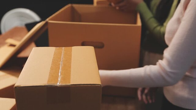 Business woman start up small business entrepreneur SME success .freelance woman working at home with Online Parcel delivery. SME and packaging deliveryconcept