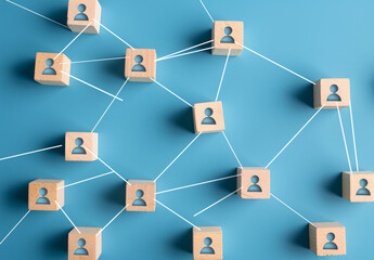 Social network graph with people icons on wooden blocks connected