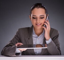 Woman with tablet computer in business concept