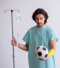 Young man staying in hospital in transfusion concept