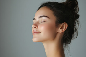 A close up of a girl's face with her eyes closed