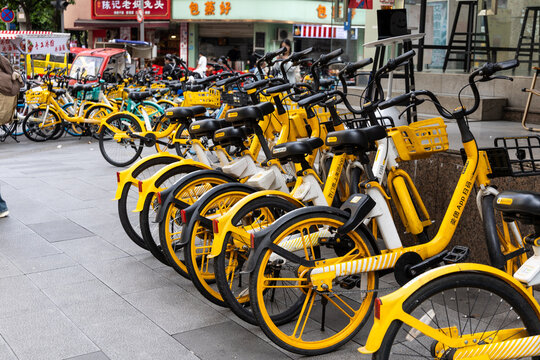 Mobike or Meituanbike is one of the biggest bike sharing company in China. Featured here are Mobike bicycles for rent conveniently available at shoulder of busy street.