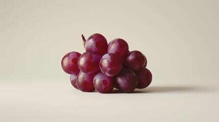 A bunch of red grapes on a white background.