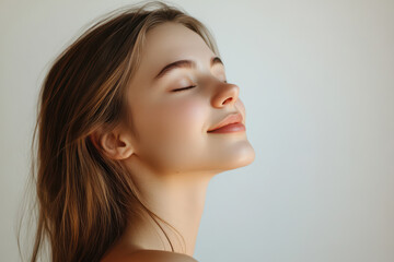 Fototapeta premium A close up of a girl's face with her eyes closed