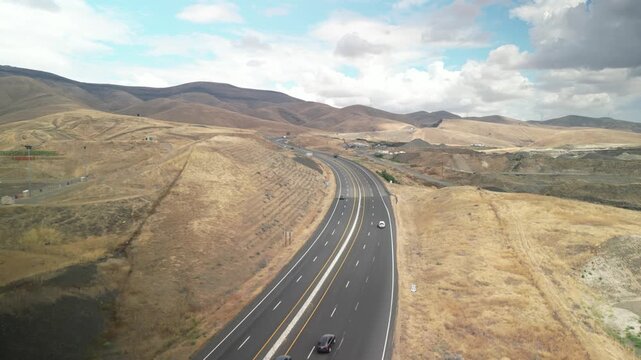 Aerial of state highway 95 near Lewiston Idaho through dry grassy hills