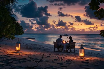 Romantic couple enjoying a candlelit dinner on the beach in the Maldives, with a beautifully set table and soft lanterns illuminating the scene.