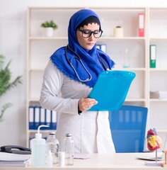 Female doctor in hijab working in the hospital