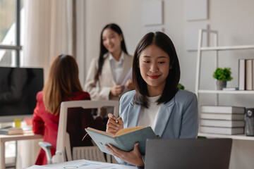 three businessperson are working in the modern office, group of employee has discussion about new project, working as teamwork is more effective, coworkers are brainstorming to planing great strategy