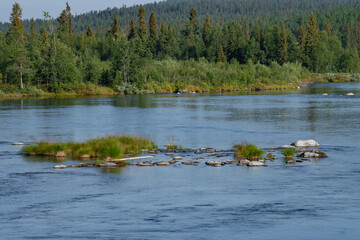 Sunny July day on the Pirenga river. Murmansk region, Russia