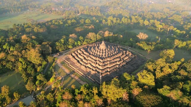 Aerial view of the majestic Borobodur Temple in Yogyakarta at sunrise, Indonesia.