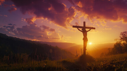 A photograph of Jesus Christ on the cross, illuminated by the setting sun, casting a dramatic shadow over the landscape